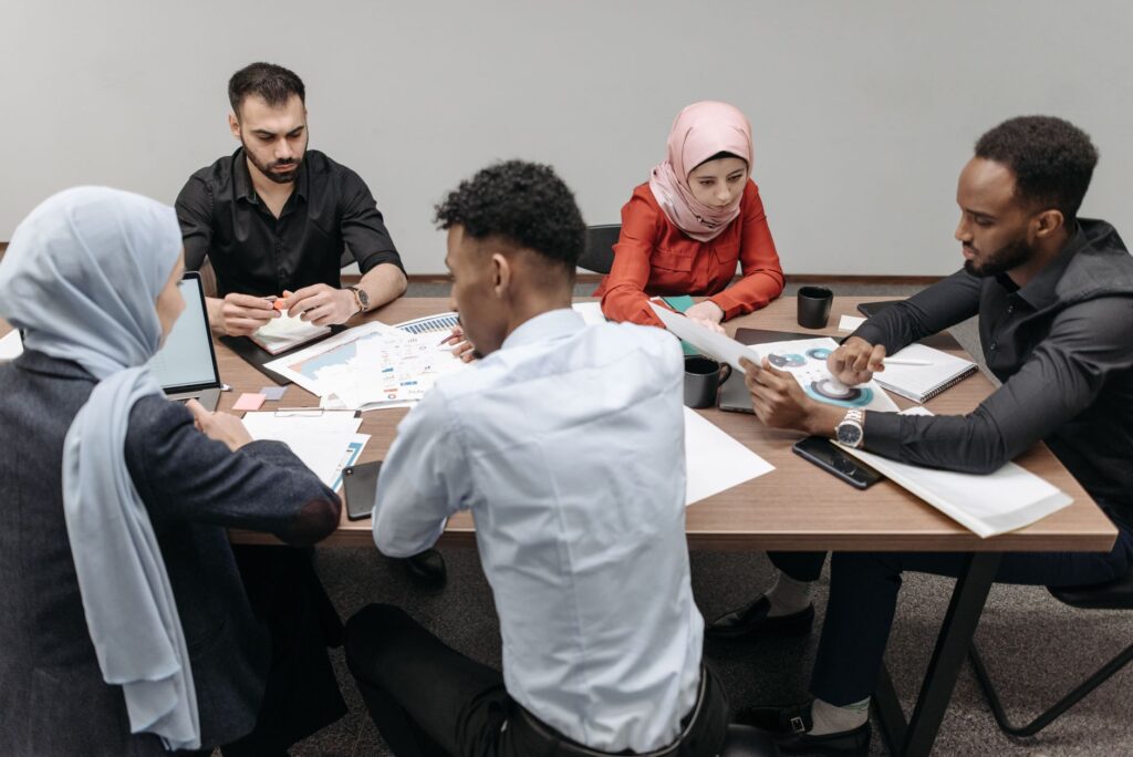 International recruitment mistakes: diverse team collaborating in a modern office